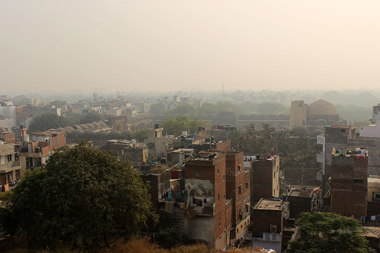 Old and New: The Begampur Masjid peeks through the modern urbanscape