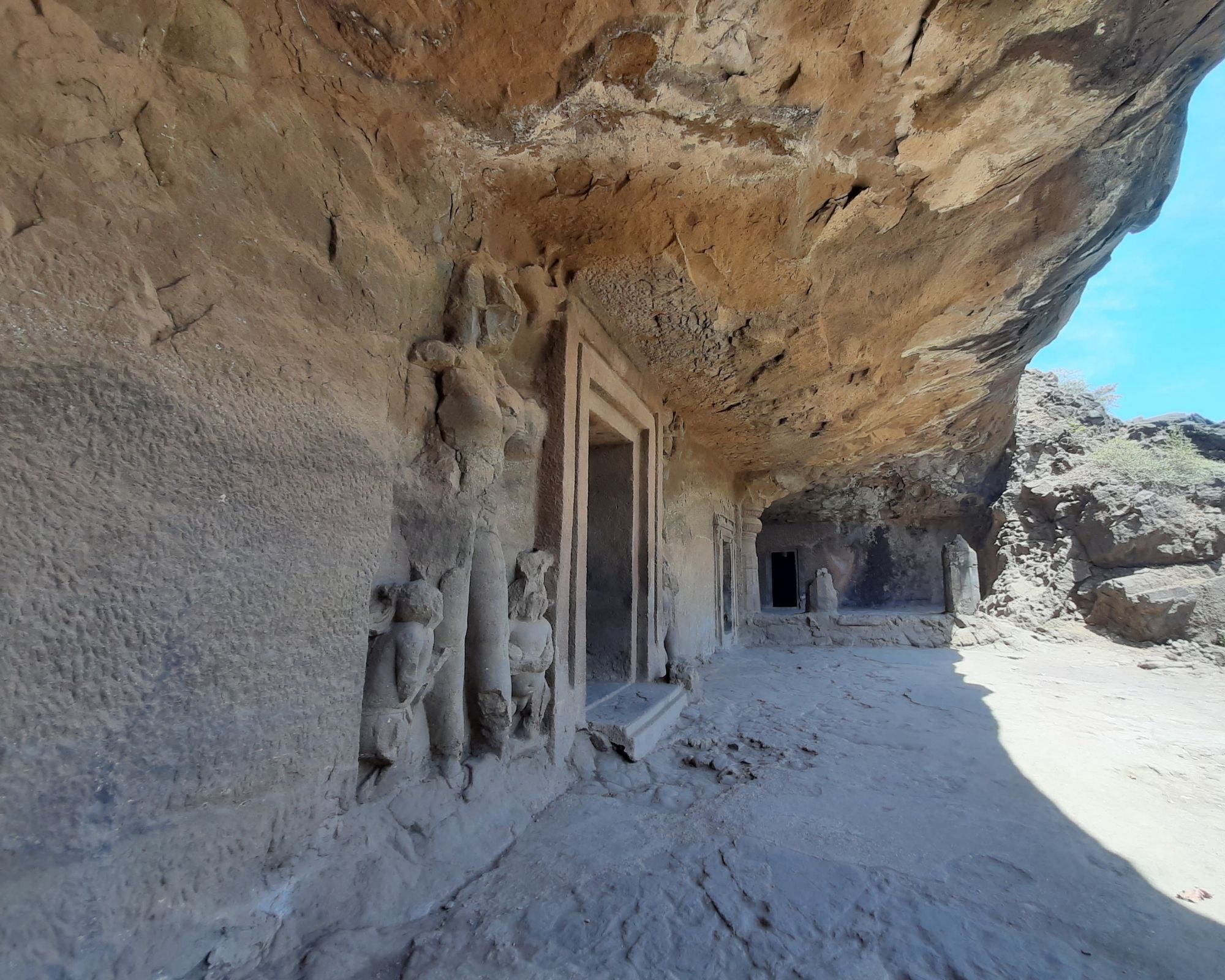 A narrative panel etched onto the cave wall.